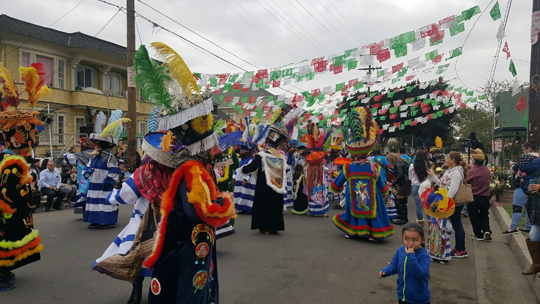 &quot;Chinelos&quot; dancers at the 2017 Cristo de Arbol Festival on 22nd Street