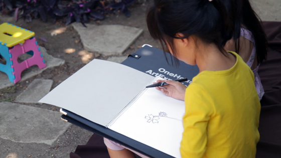 Child drawing flower